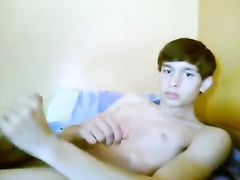 Cutie twink is jerking off his dick on couch