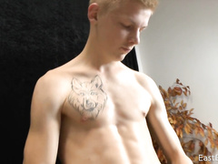 Skinny blonde twink hotly undresses and fondles his dick