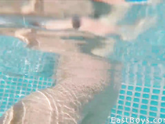 Twink friends are teasing each other in the pool
